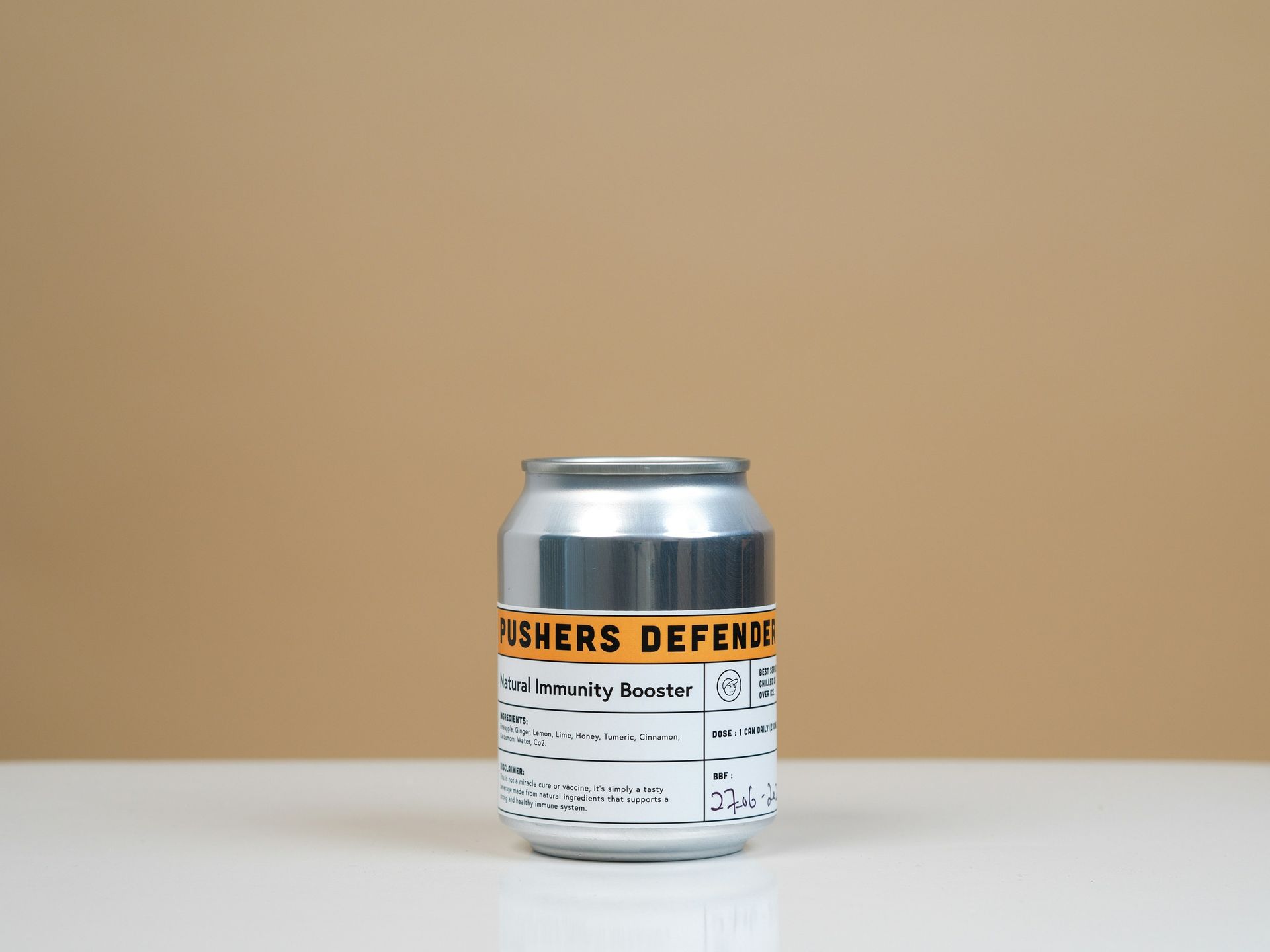 A can of beer is sitting on a white table.