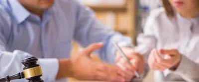 Man and woman signing legal documents