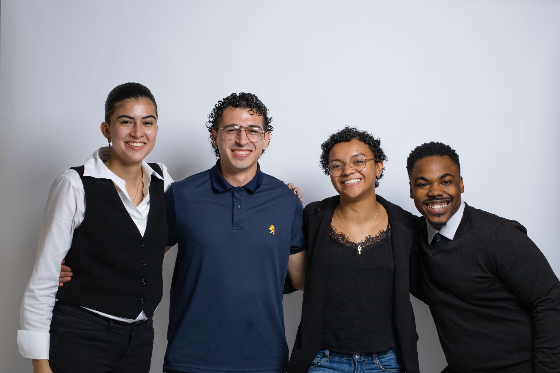 A group of young people are posing for a picture together.