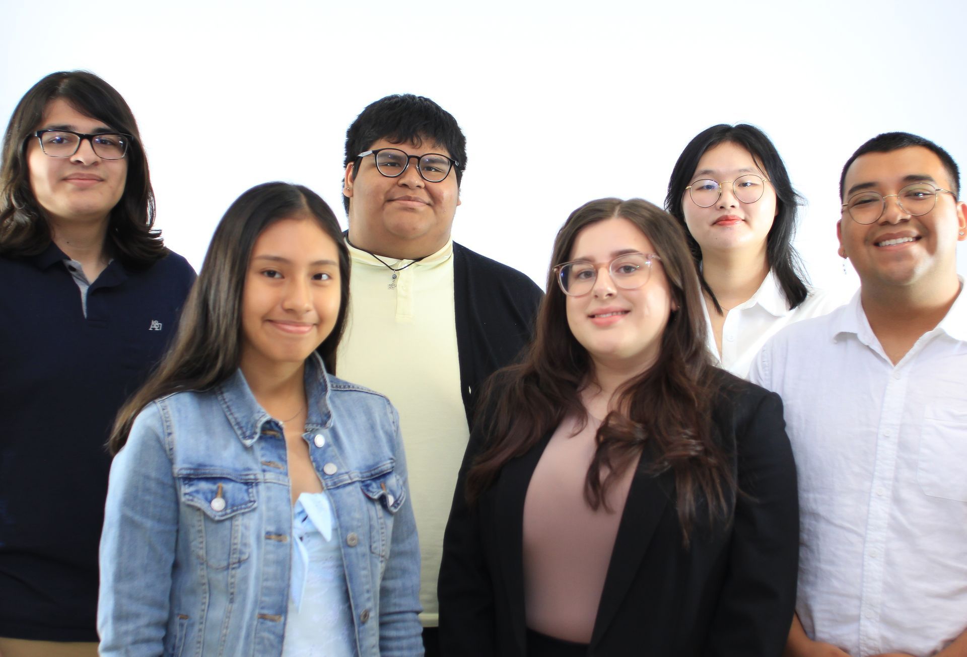 A group of people are posing for a picture together.