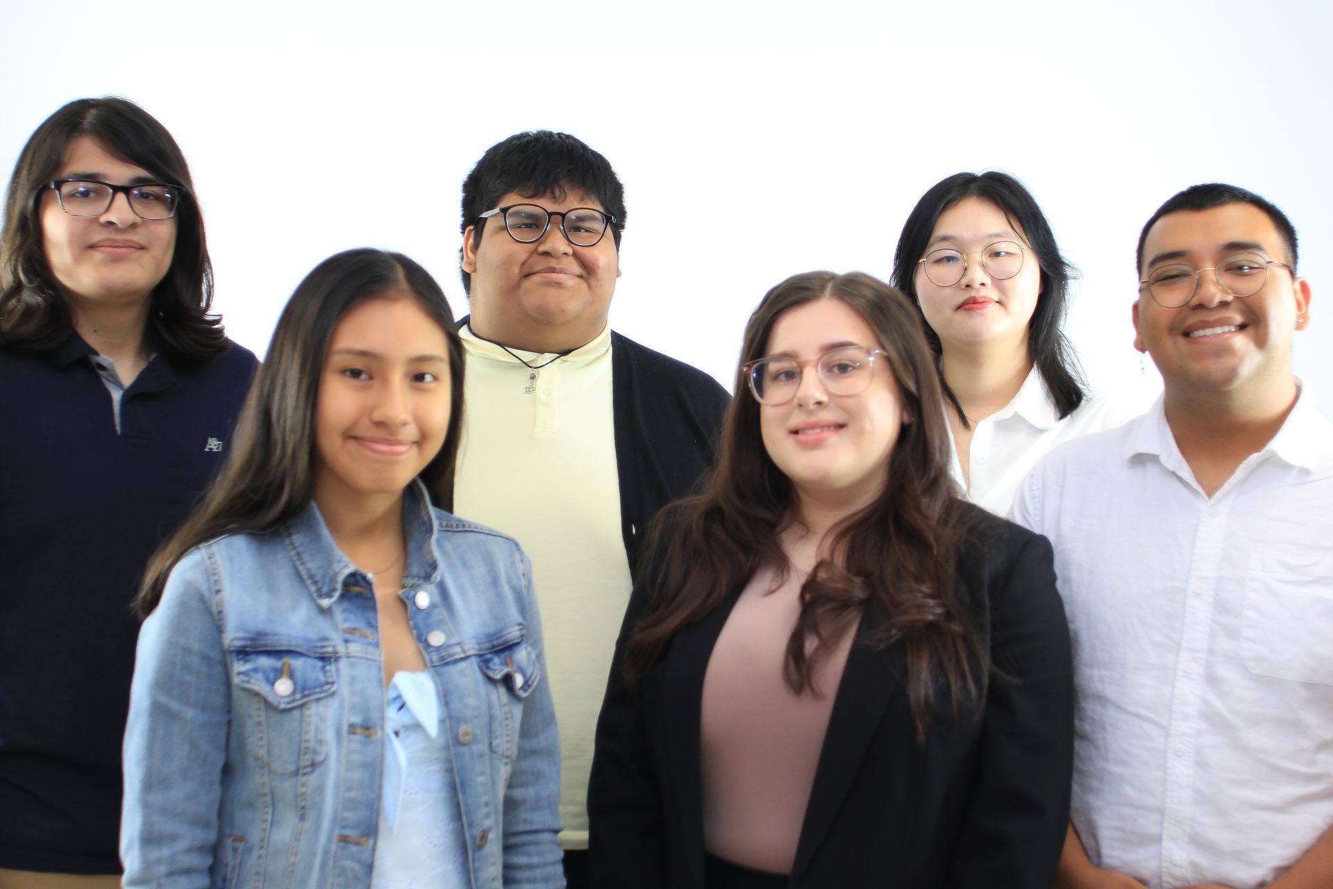 A group of people are posing for a picture together.