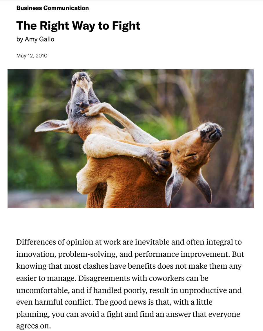 A kangaroo carrying a baby kangaroo on its back.