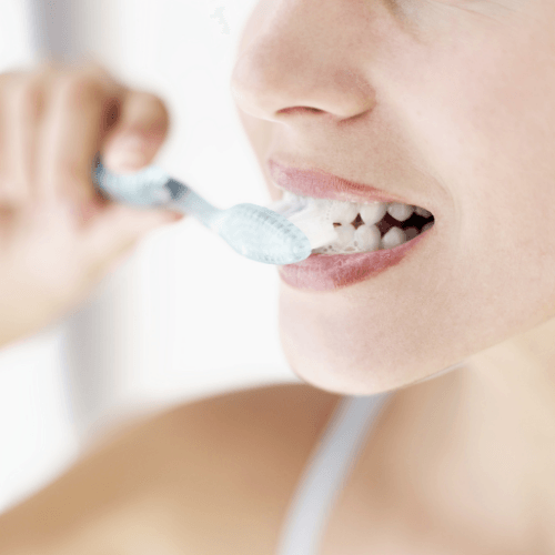 close up woman brushing | Professional teeth cleaning in Overland Park 66221 for a healthy smile.