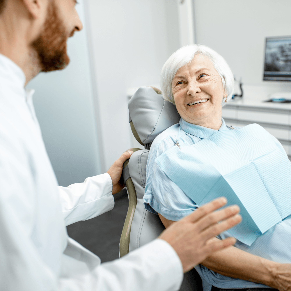 Older woman smiling | Replace missing teeth with affordable dentures in Overland Park 66221.
