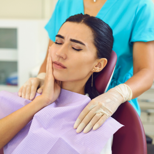 woman in pain | Visit the best dentist in Overland Park 66221 for top-quality dental care.