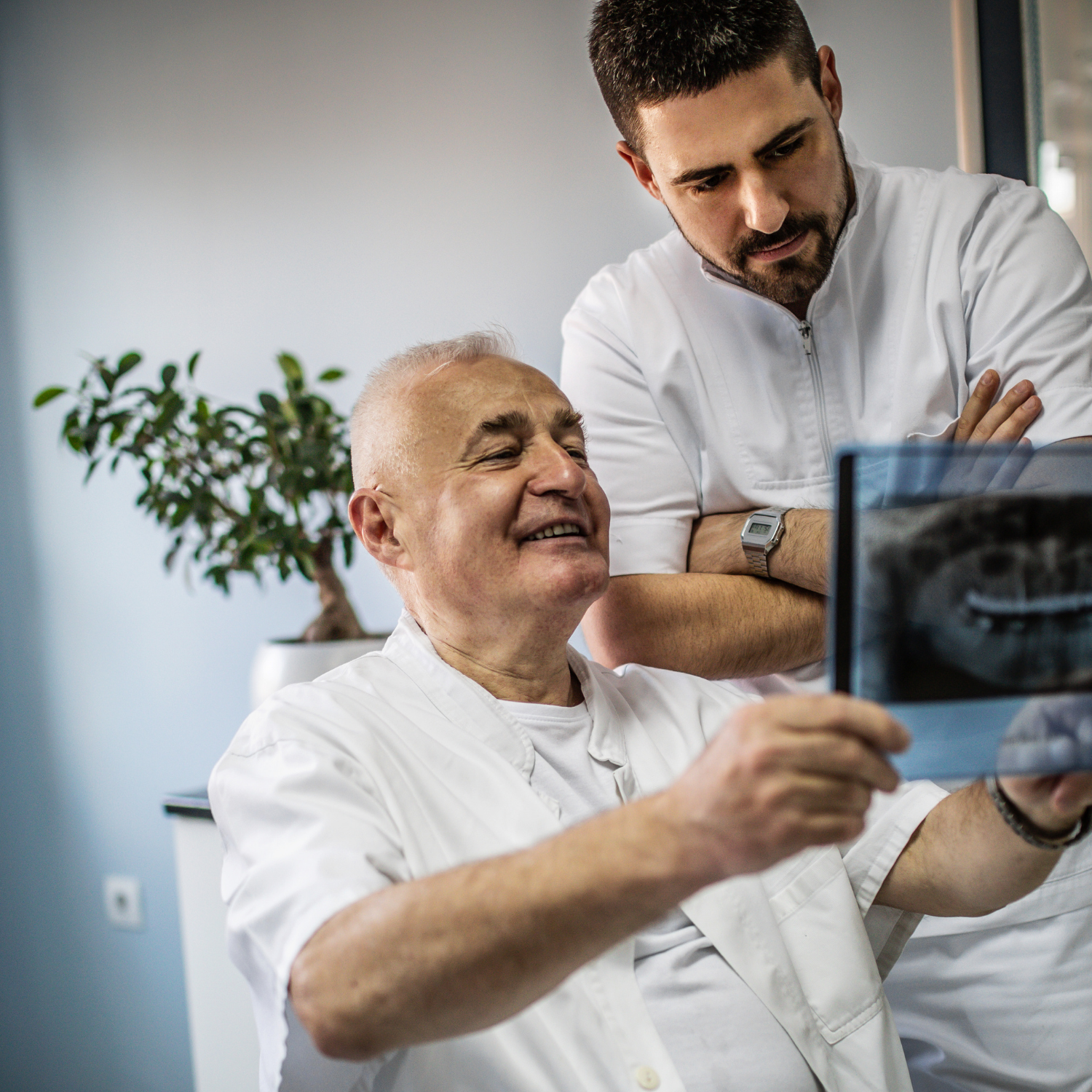 older man looking at teeth xray | Replace missing teeth with affordable dentures in Overland Park 66221.
