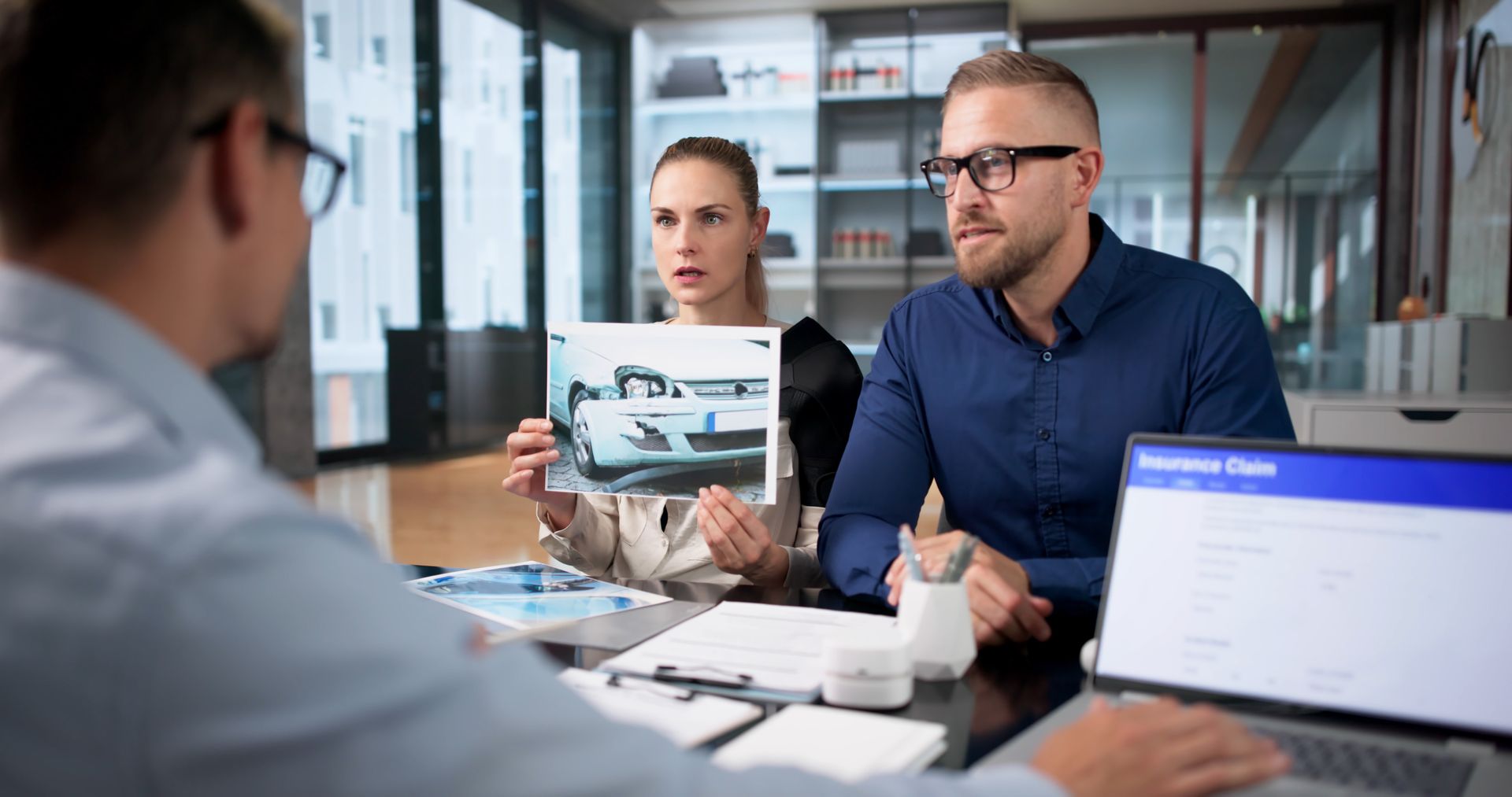 Man and woman review car accident injury case details.