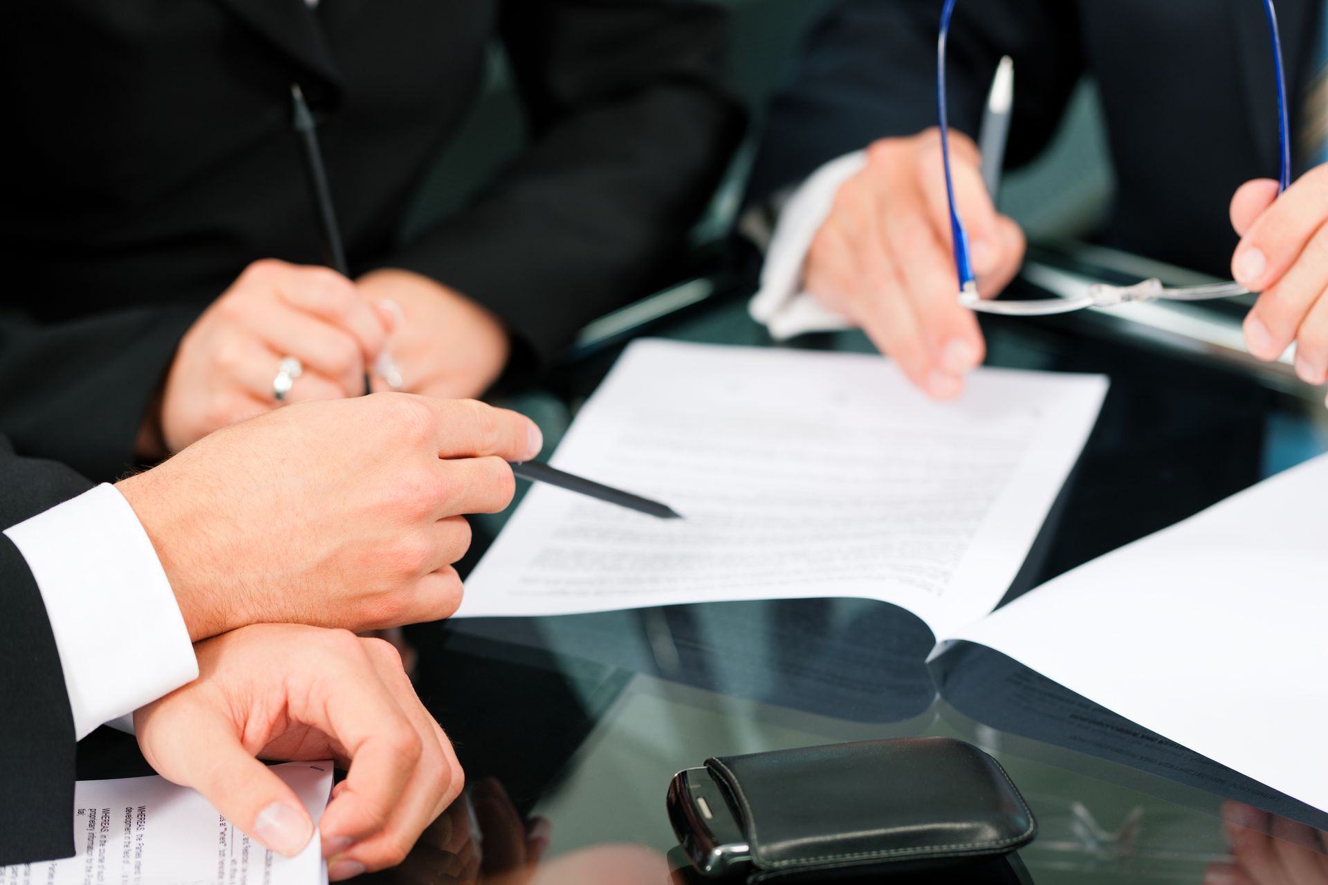 Business meeting with work on contract | Jones, Boykin & Associates, P.C 