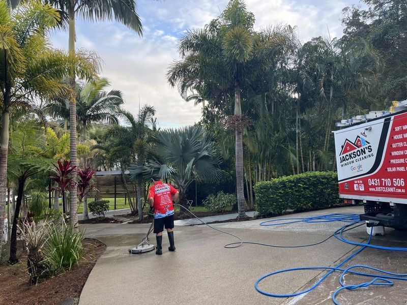 Man Power Washing a Driveway — Jackson's Window Cleaning in Nerang, QLD