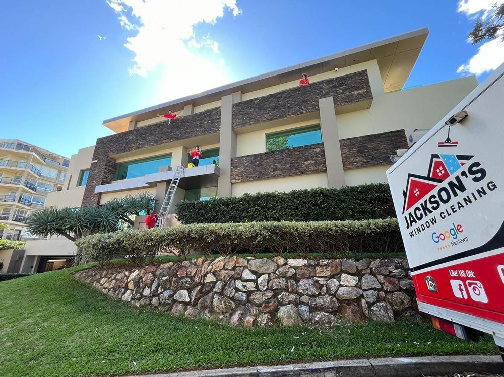 Men Washing House Exterior — Jackson's Window Cleaning in Nerang, QLD