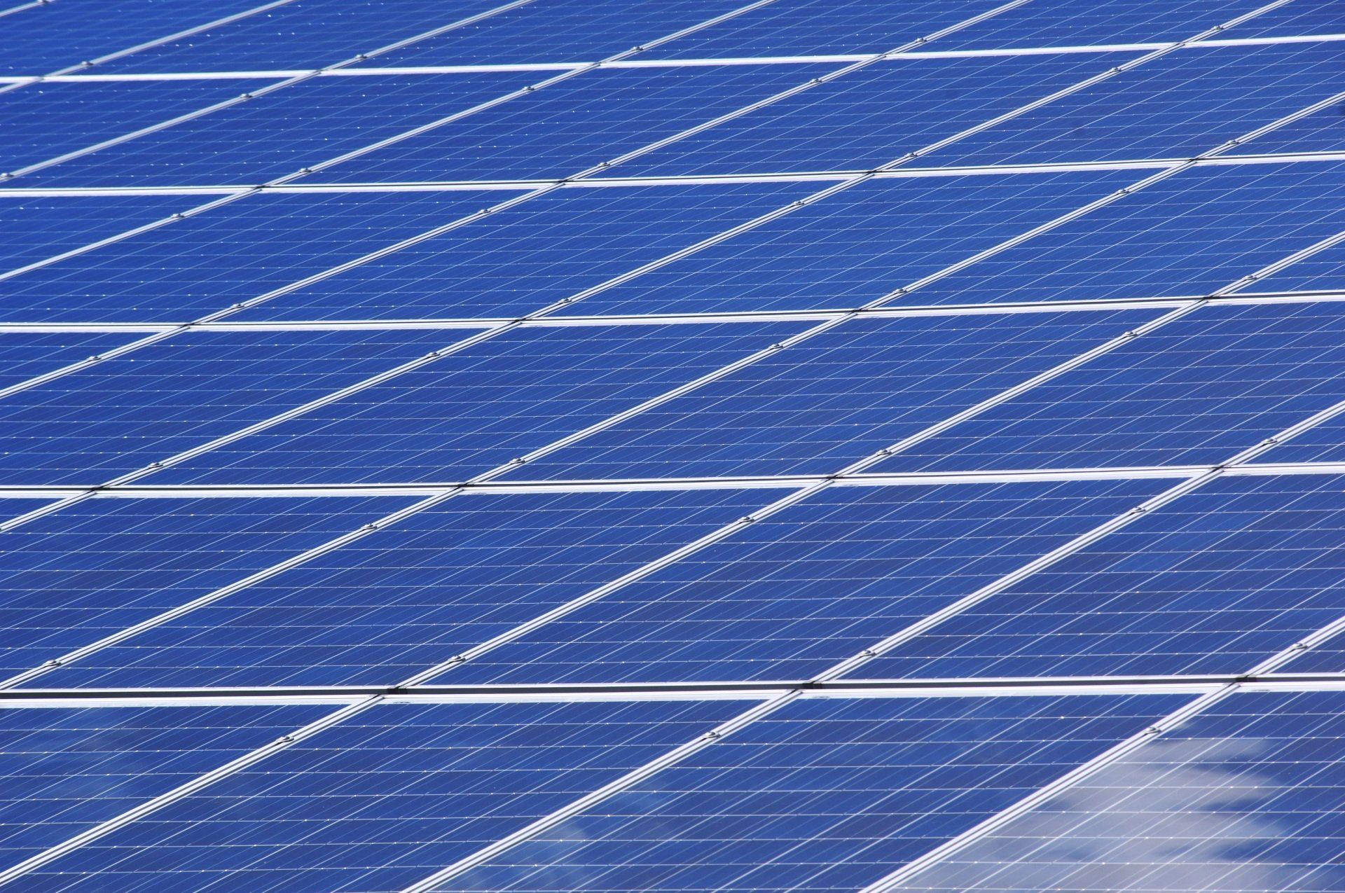 Solar Panels on a Roof, Arranged in a Grid Pattern — Jackson's Window Cleaning in Nerang, QLD
