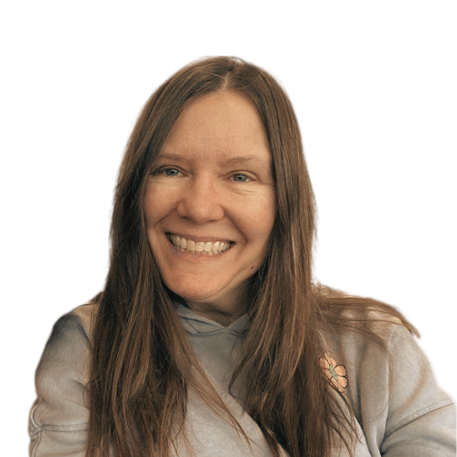 A woman with long brown hair is smiling for the camera.
