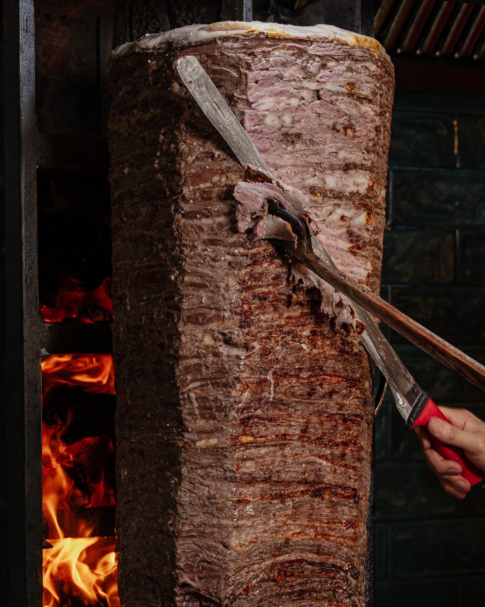 Fresh wood-fired döner on the rotisserie