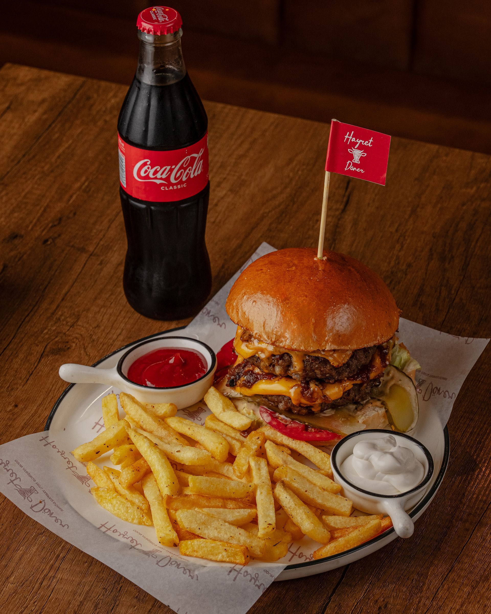 Burger served with Coca-Cola at Hayret Döner