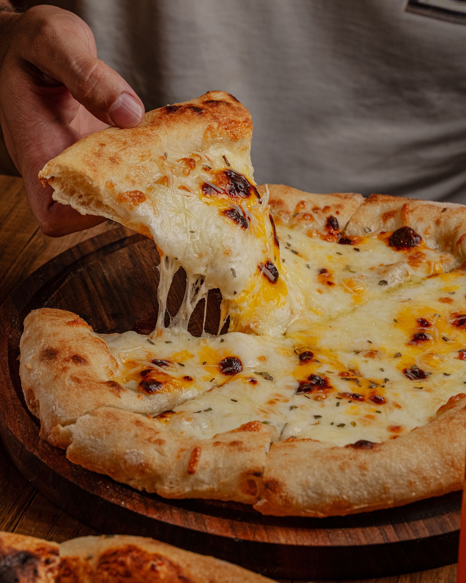 Freshly baked cheese pizza with melted mozzarella
