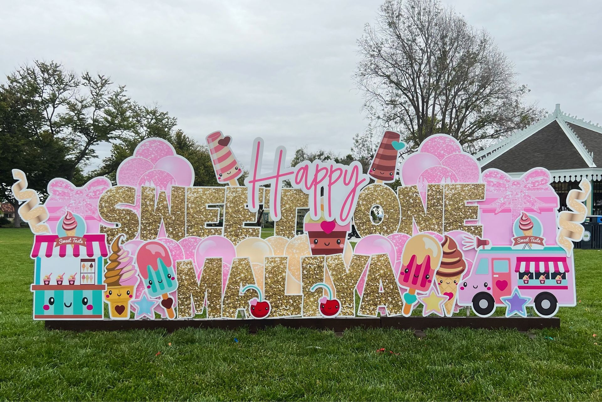 A pink and gold themed display is shown with an ice cream theme.