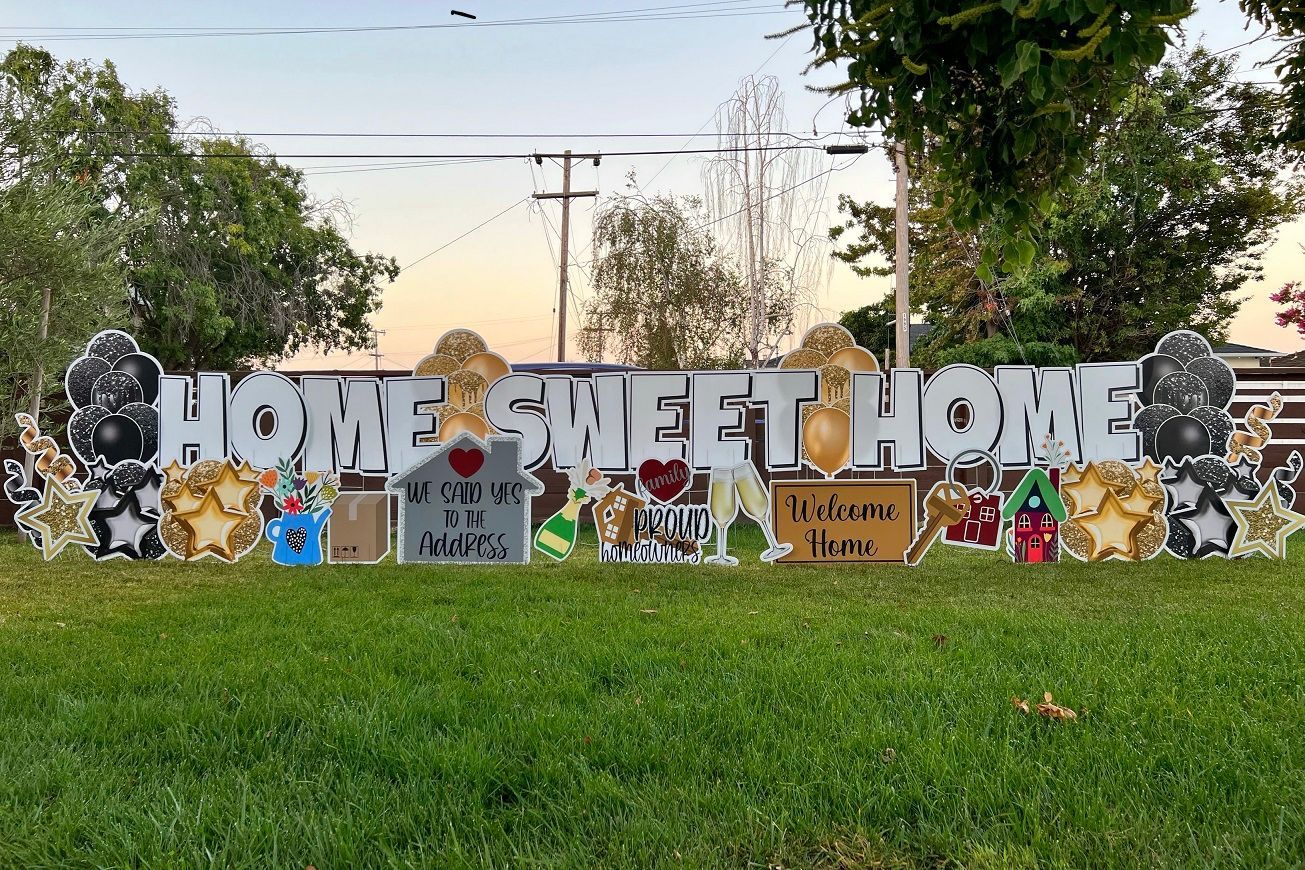 Welcome Home Yard Cards with images of house keys, moving boxes, door mat, balloons, and stars. 