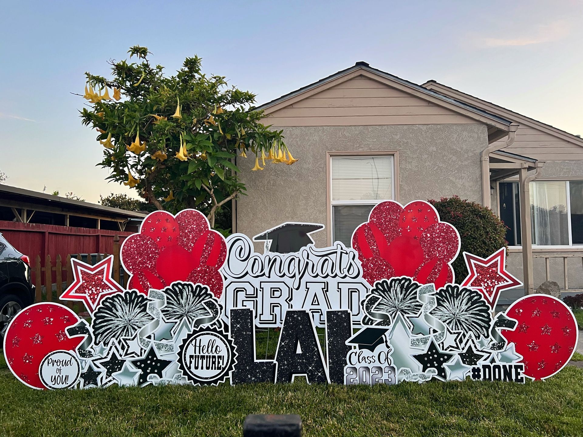 Standard graduation package with Congrats Grad lettering as well as the graduates name, Lai. 