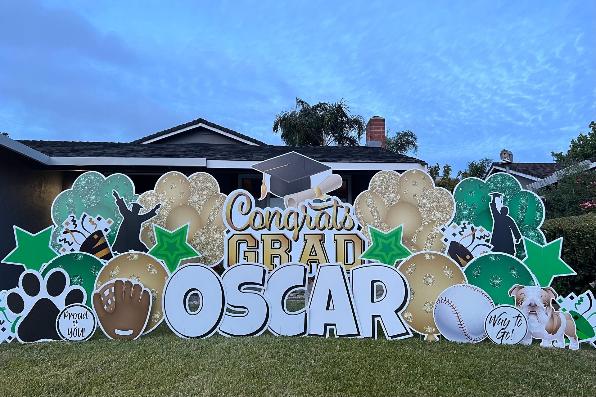 Deluxe graduation display Congrats Grad Oscar in green, gold, and white. Special interests include baseball and dogs. 
