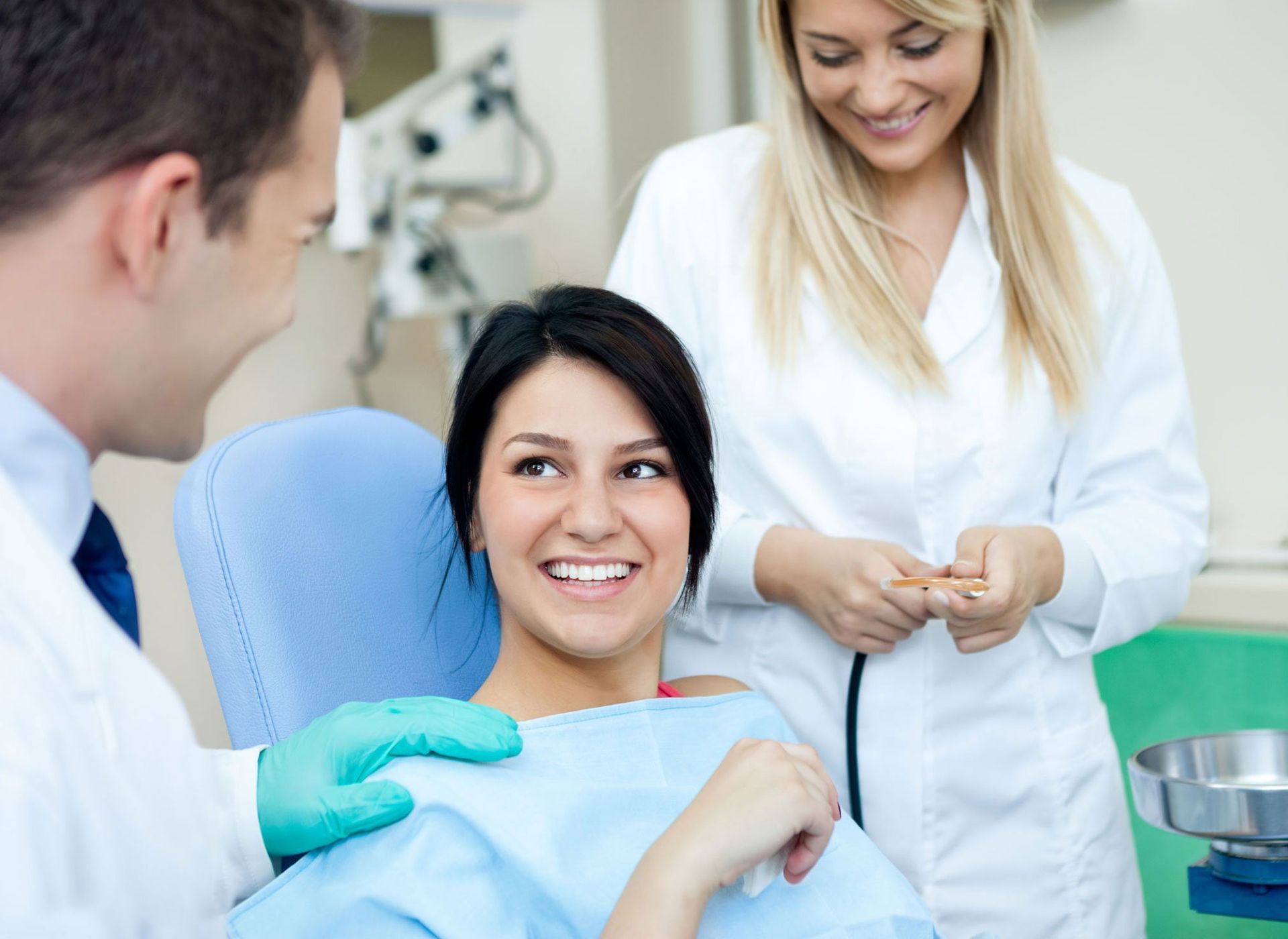 Fillings A woman is sitting in a dental chair talking to a dentist.