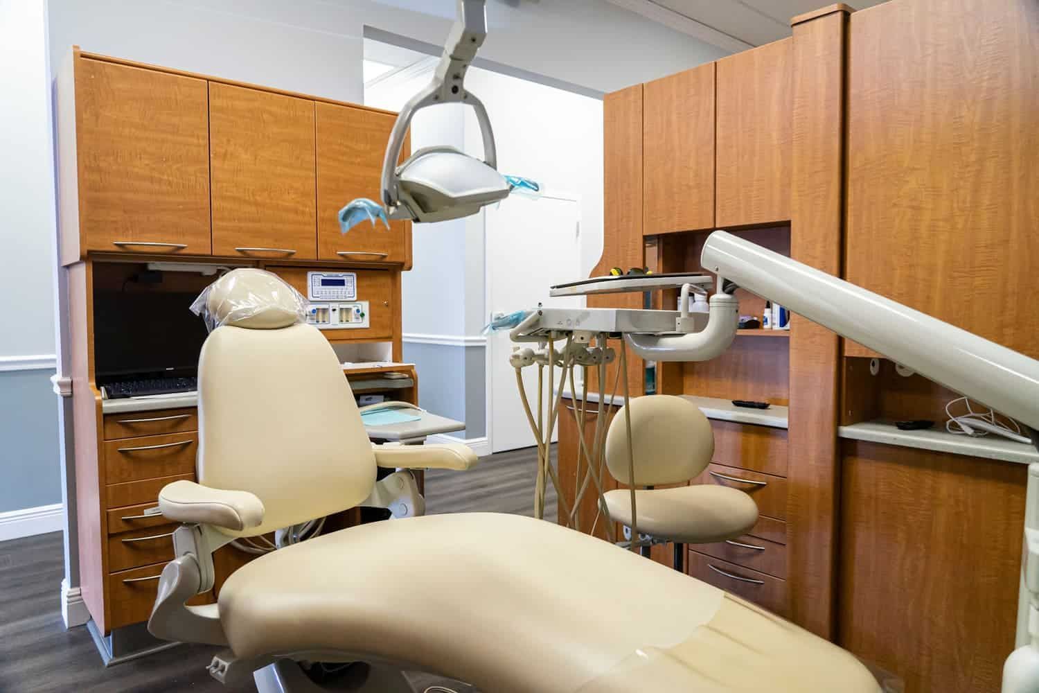 There is a dental chair in the dental office.