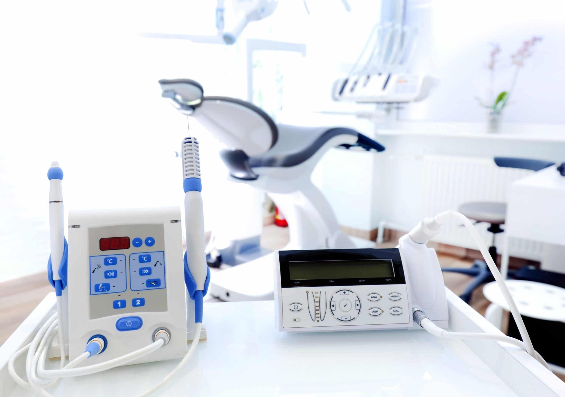 cosmetic treatments in Apopka A dental office with a dental chair and dental equipment on a table.