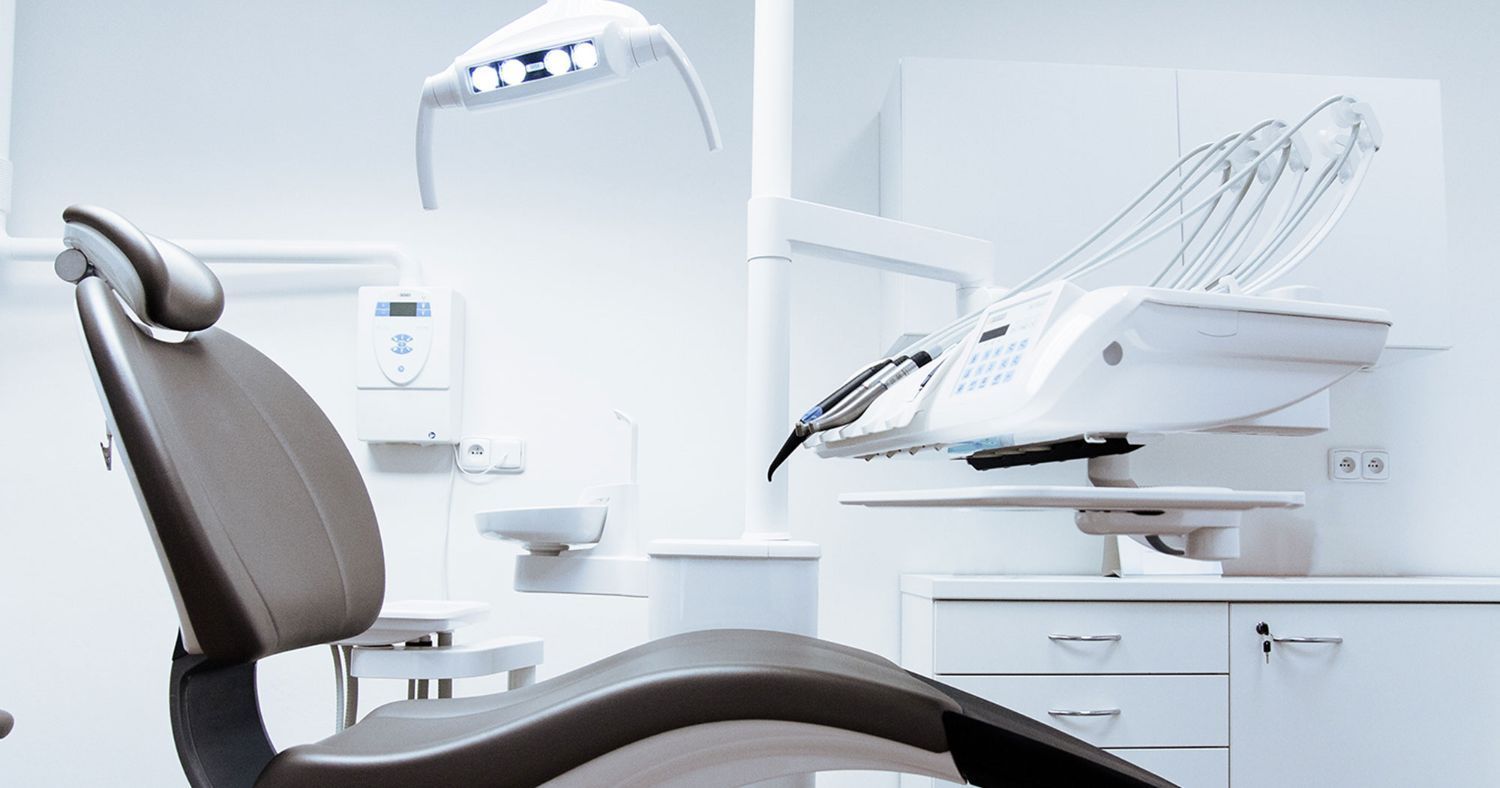 Apopka Smiles A dental chair is sitting in a dental office.
