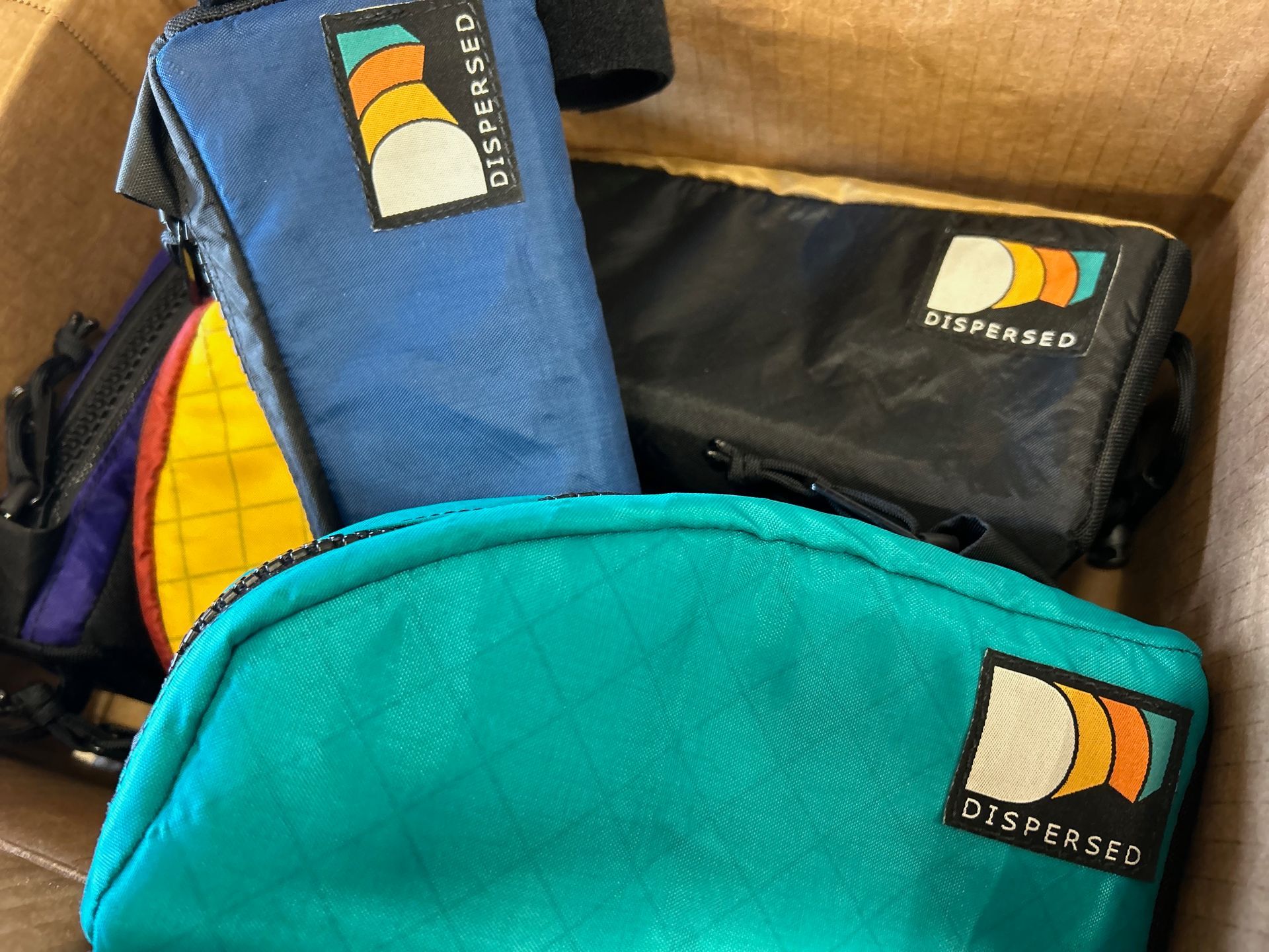 A box filled with a bunch of different colored bags