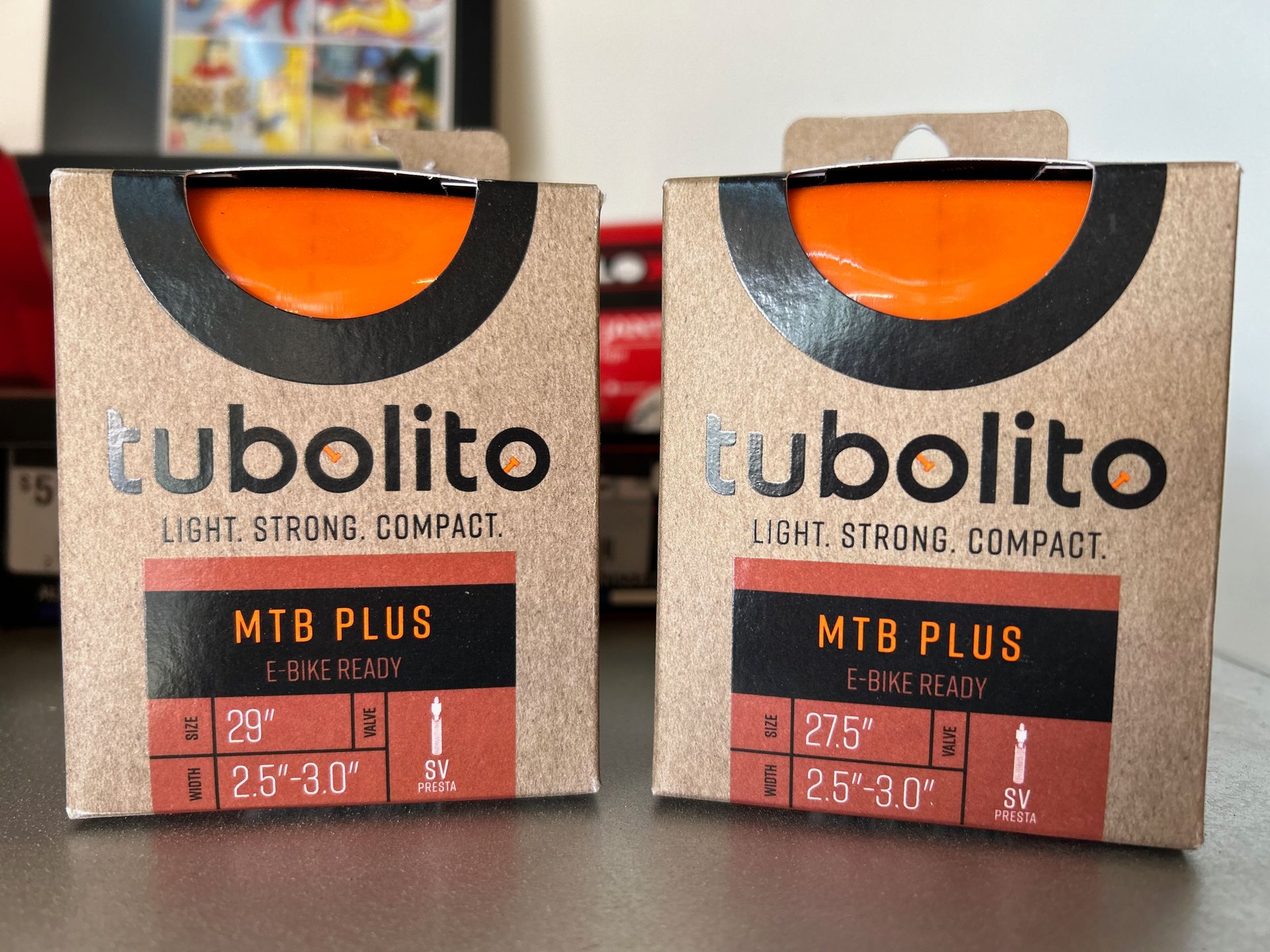 Two boxes of tubolito mtb plus are sitting on a table