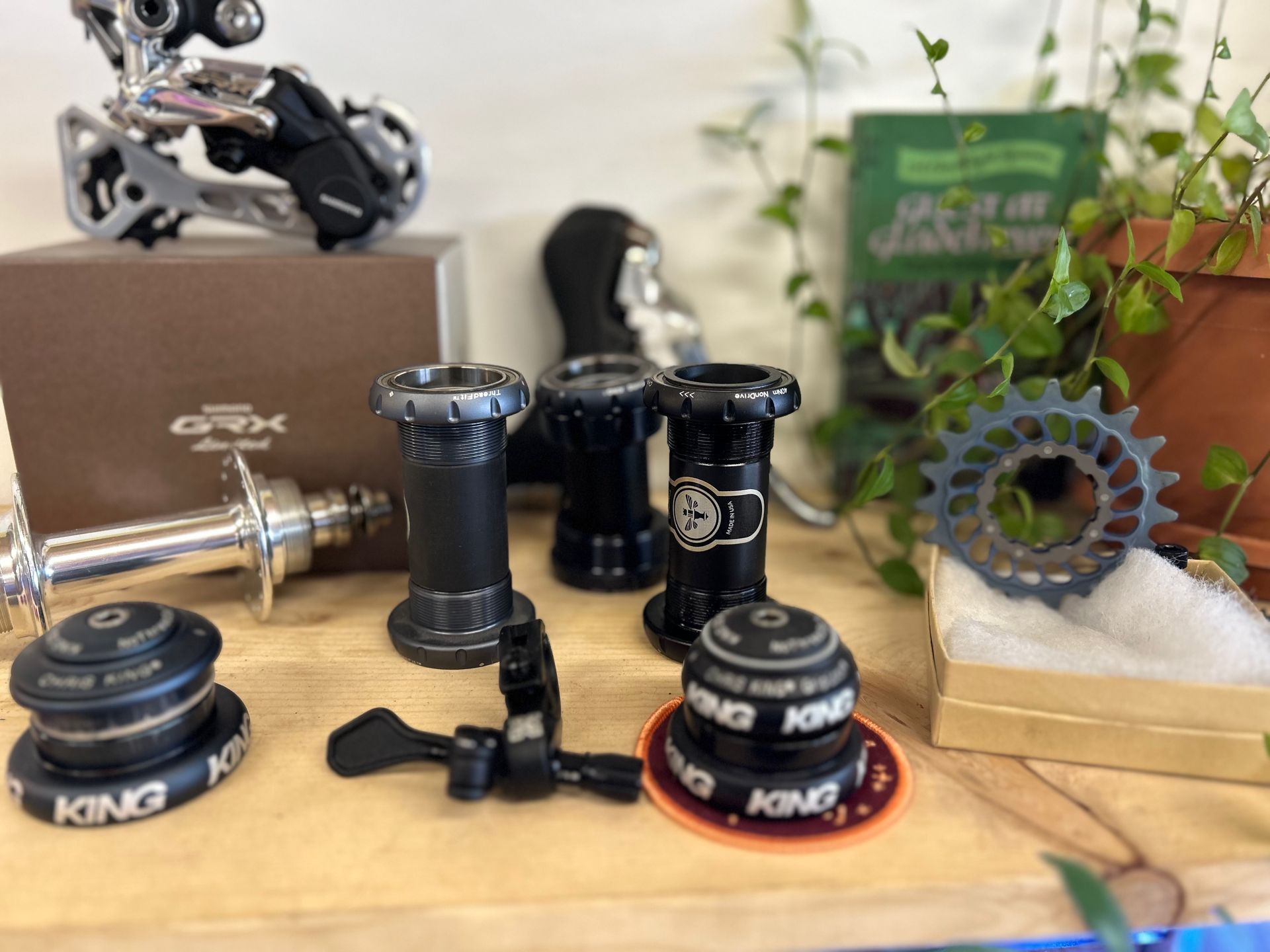 A table with a bunch of bicycle parts on it