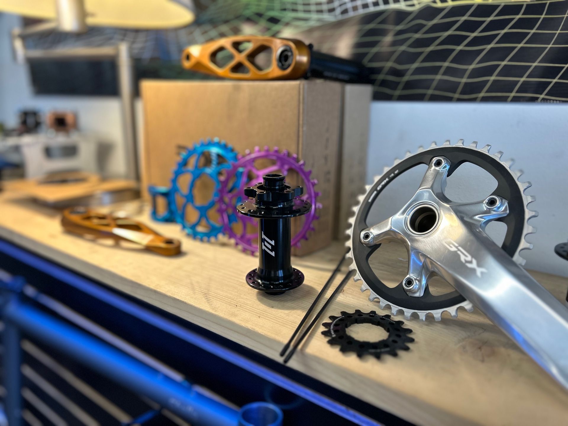 A table with a bunch of bicycle parts on it