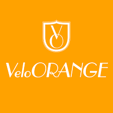 A white logo on a yellow background that says velo orange