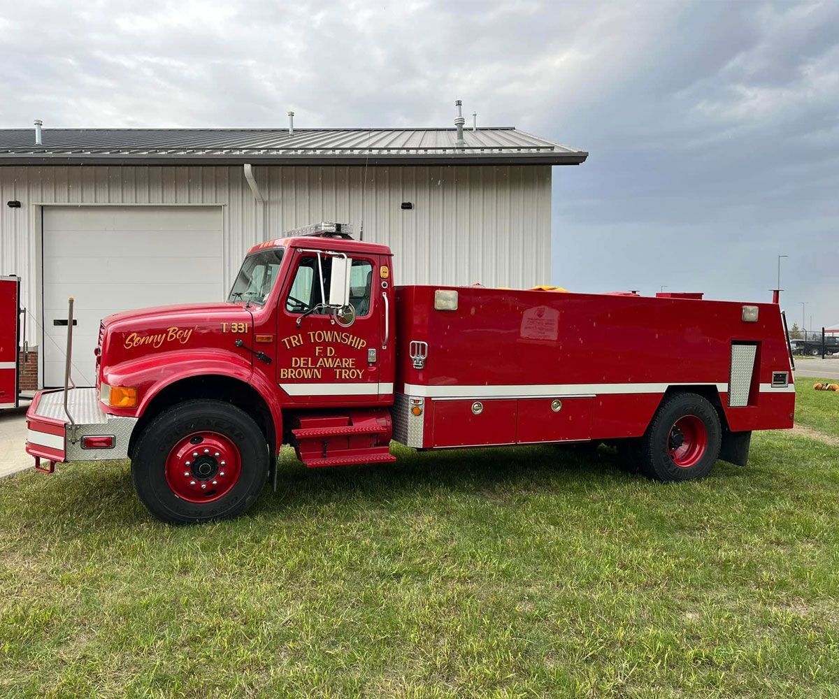Tri Township historical photo of 1952 fire engine in front of new 331 station
