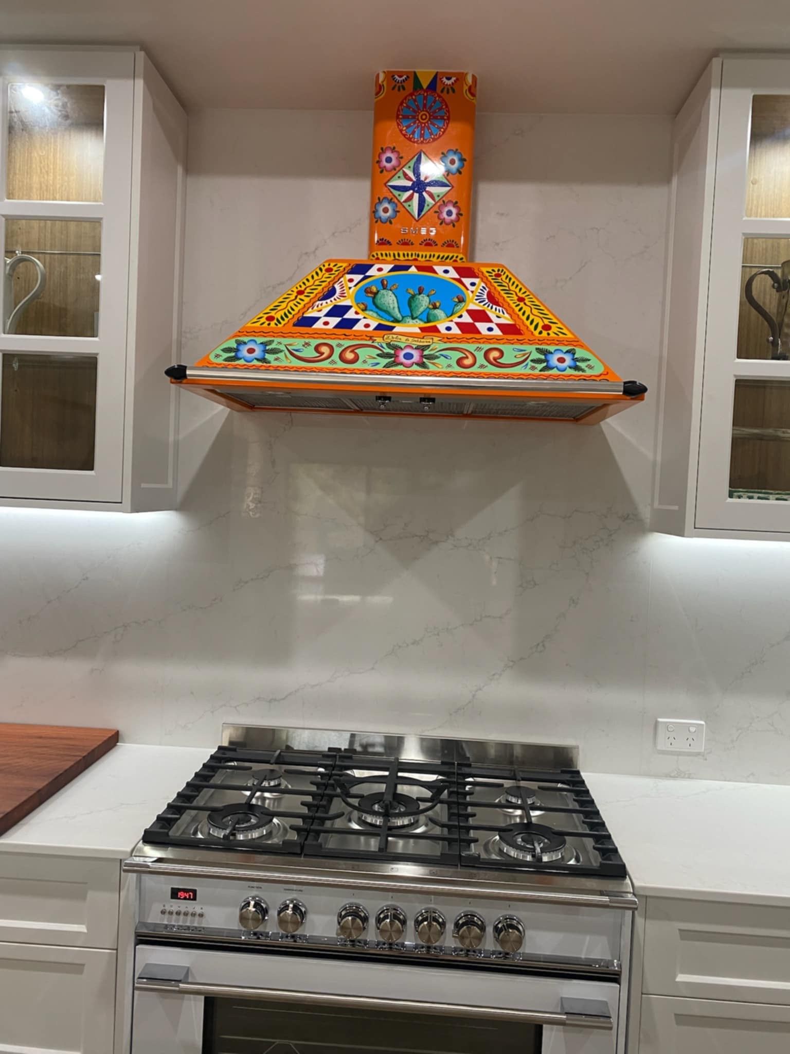 A Colorful, Hand-painted Range Hood Featuring Floral and Geometric Patterns — Priority Painters in Gladstone Central, QLD