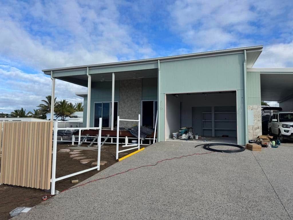 A Modern Single-story House Under Construction With a Gravel Driveway — Priority Painters in Gladstone Central, QLD
