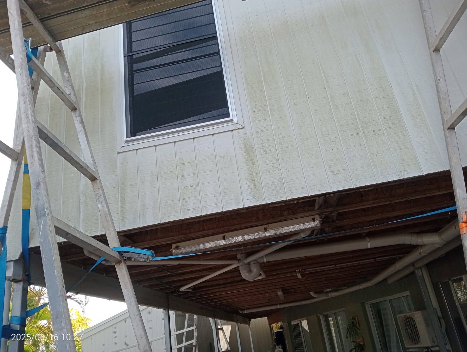 A Low-angle View Shows the Exterior of a House Under Renovation — Priority Painters in Gladstone Central, QLD