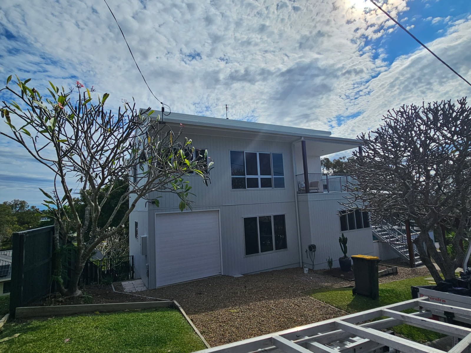 Two-story White Residential House With a Single-car Garage — Priority Painters in Gladstone Central, QLD