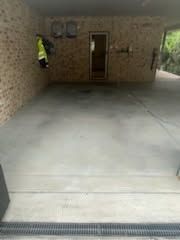 A Concrete Driveway Leads Into a Covered, Open-air Carport — Priority Painters in Gladstone Central, QLD