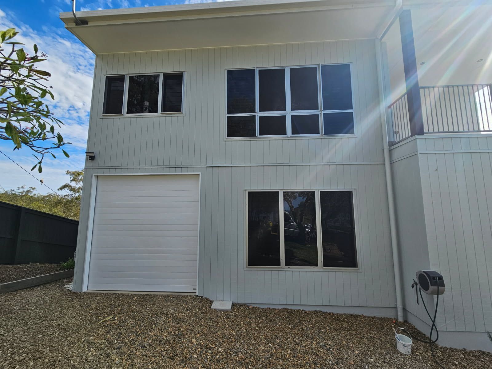 Two-story House Exterior With Gray Vertical Wood Paneling — Priority Painters in Gladstone Central, QLD