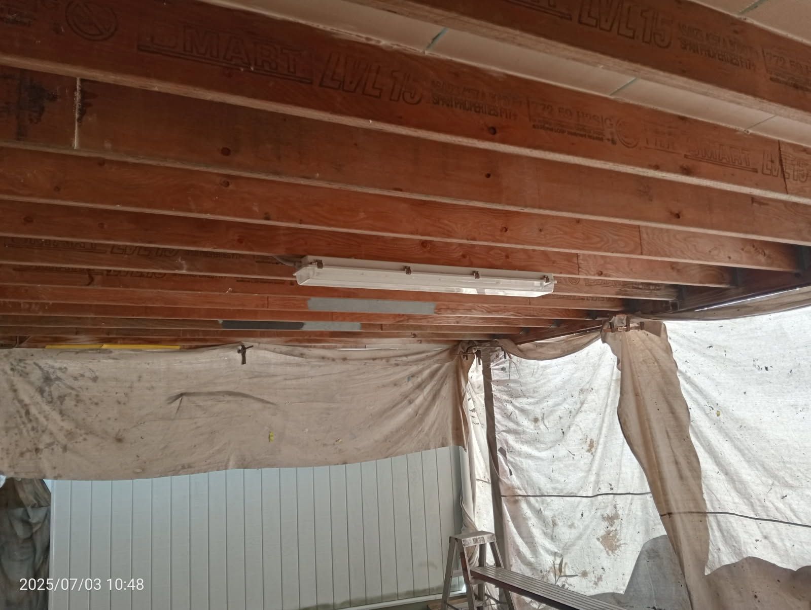 Underside of a Wooden Ceiling With Exposed Beams — Priority Painters in Gladstone Central, QLD
