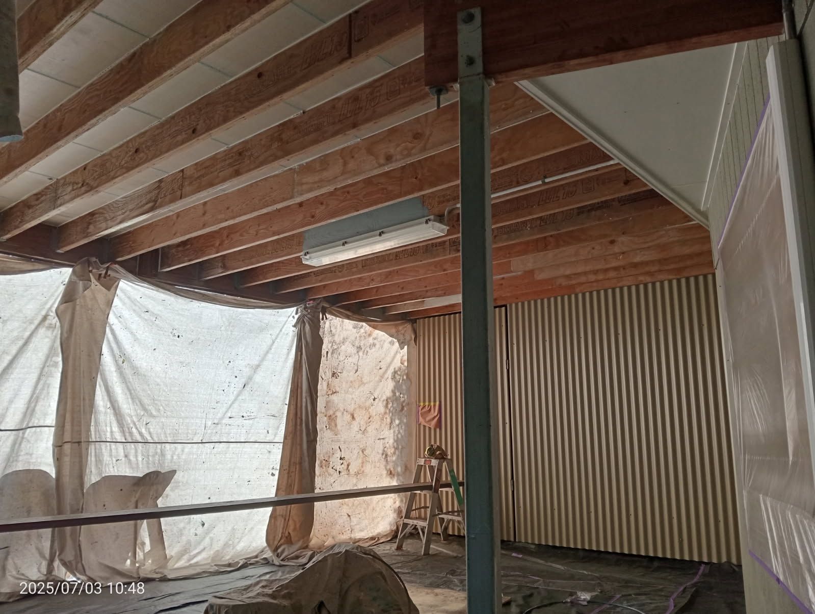 A Construction Project Featuring Exposed Wooden Ceiling Joists — Priority Painters in Gladstone Central, QLD