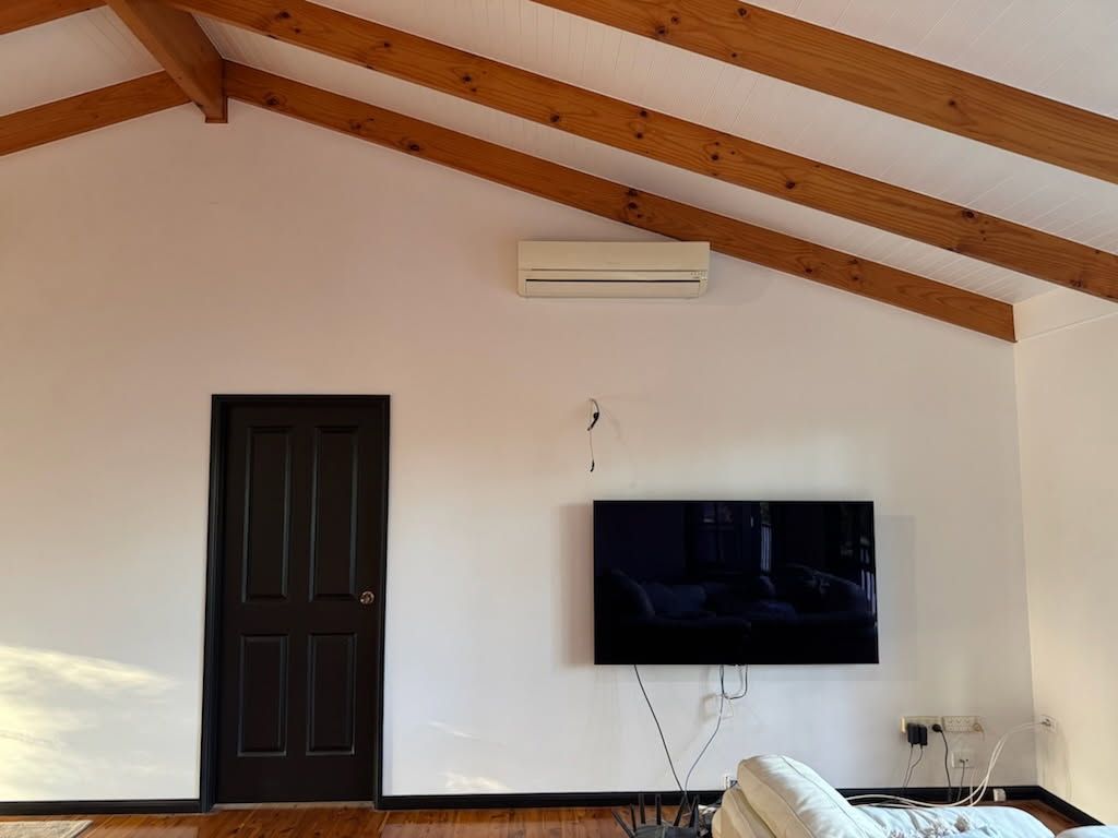 A Vaulted Ceiling Made of Warm-toned Wood Planks — Priority Painters in Gladstone Central, QLD
