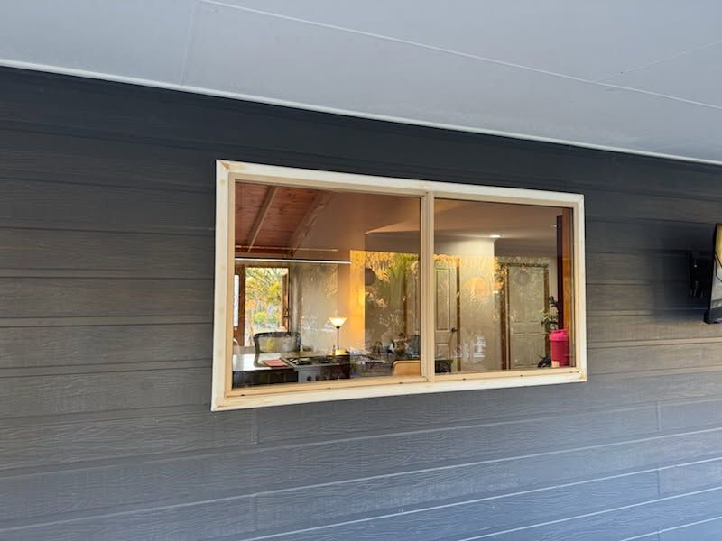 A Rectangular Window With a Light-colored Wood Frame Set — Priority Painters in Gladstone Central, QLD