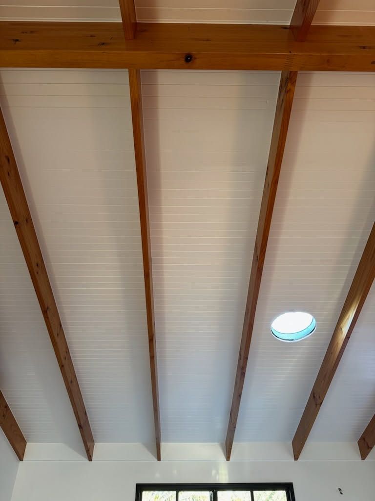 White Ceiling Panels Installed Between Evenly Spaced, Horizontal — Priority Painters in Gladstone Central, QLD