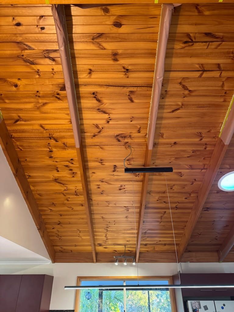 A High, Vaulted Wooden Ceiling With Exposed Structural Beams — Priority Painters in Gladstone Central, QLD
