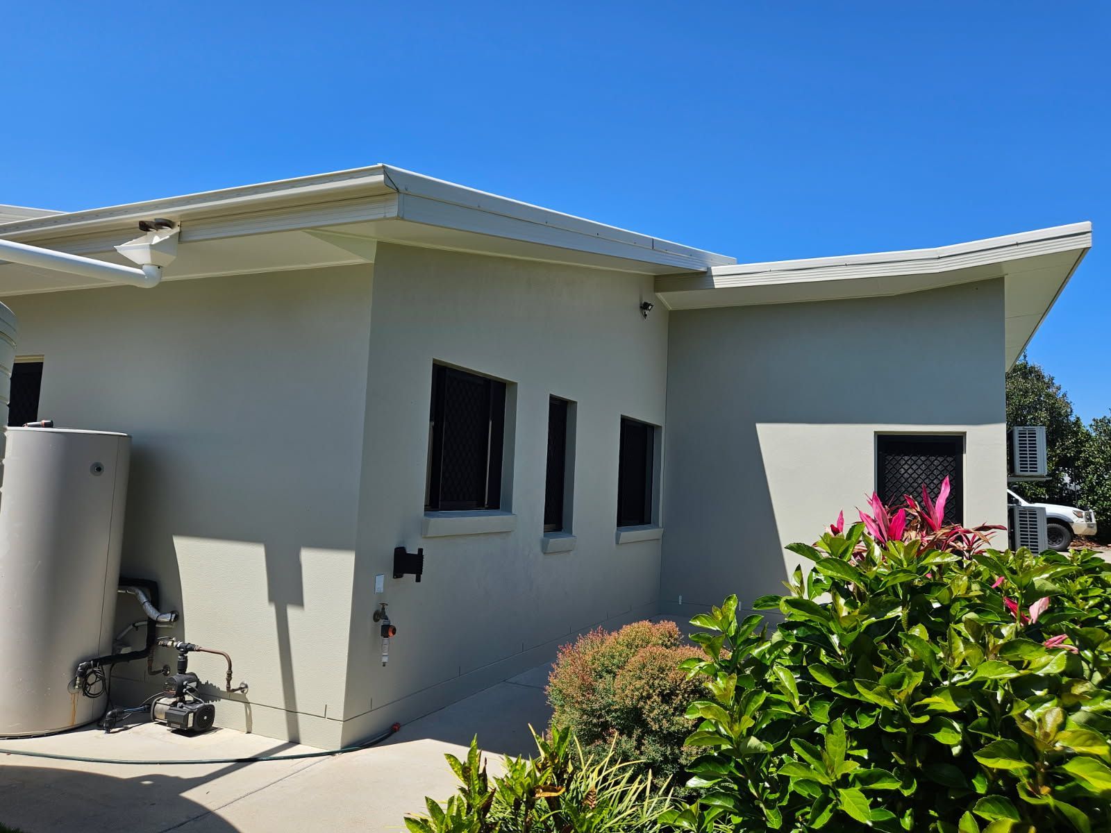 A with A Large Water Tank in The Side Yard — Priority Painters in Tannum Sands, QLD