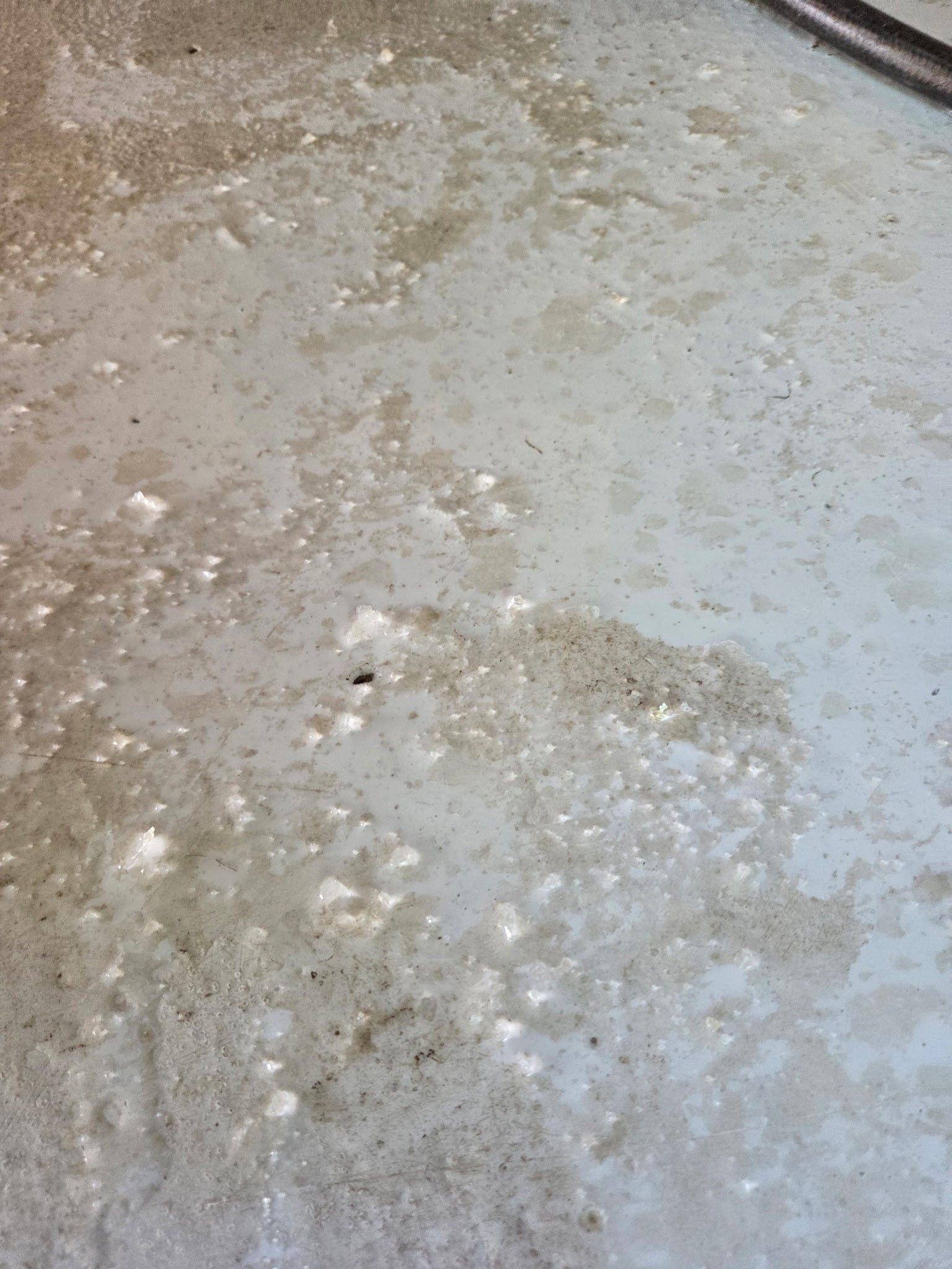 A Concrete Floor With Patchy, Worn Light-gray Paint — Priority Painters in Gladstone Central, QLD