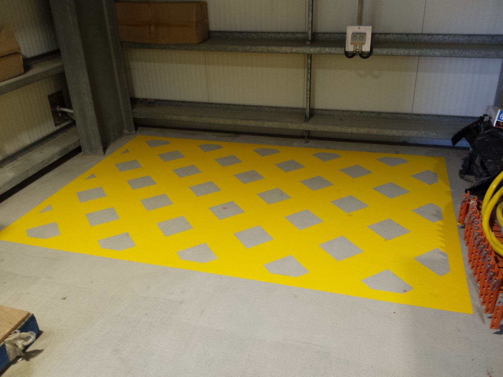 A Yellow Floor Marking Featuring a Diamond-patterned Grid — Priority Painters in Gladstone Central, QLD