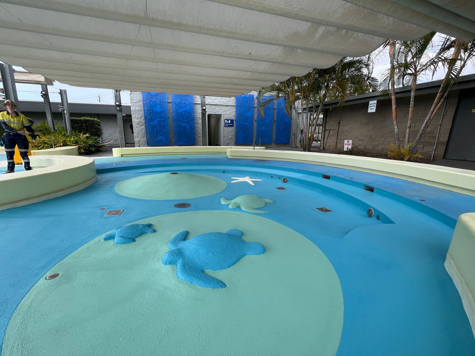 Outdoor Splash Pad With Blue and Light Green Floor — Priority Painters in Gladstone Central, QLD