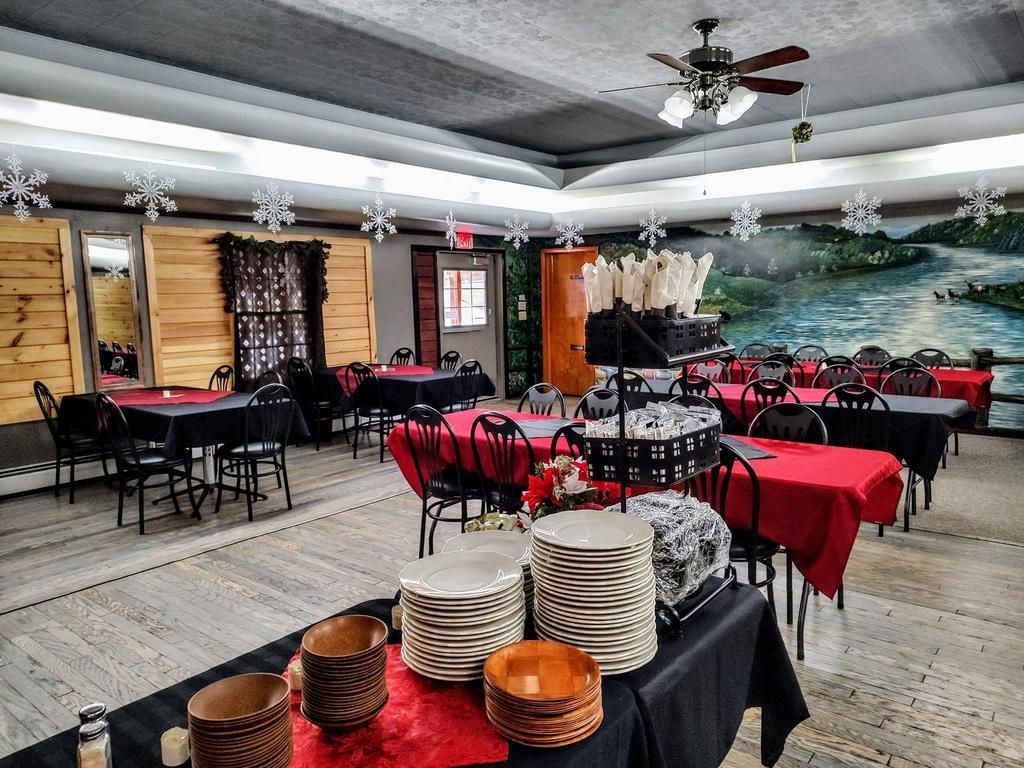 a dining room with tables and chairs and plates and bowls